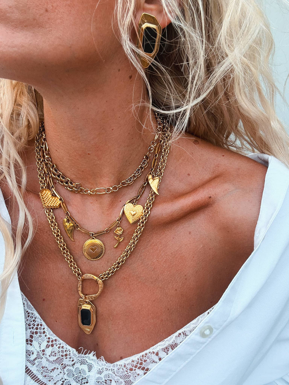 Statement gold charm necklaces with chunky chains